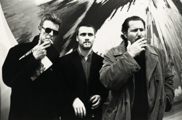 David Bowie, Damien Hirst, Julian Schnabel, New York. 1996 by Roxanne Lowit, three men smoking