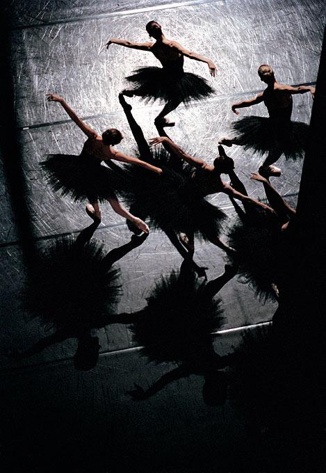 Etudes de Harald Lander ballet de l Opera National de Paris by Gérard Uféras, Ballerinas in black tutus in bright spotlight on stage