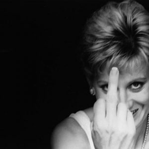 Diana. Finger Up. 2000 by Alison Jackson, Lady Diana lookalike holding her middle finger at the camera, smiling