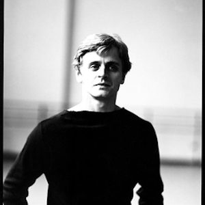 MIKHAIL BARYSHNIKOV AT NEW YORK CITY BALLET by Arthur Elgort, black and white portrait of the dancer in a black shirt
