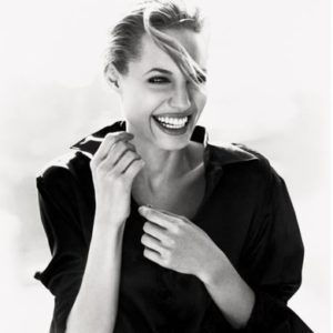 Angelina Jolie by Sante D'Orazio, black and white portrait of the actress in a white shirt