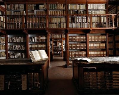 Biblioteca Firenze Biblioteca Firenze by Massimo Listri, old library with wooden shelves and gallery