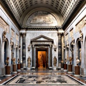 Brazio Nuovo by Massimo Listri, hall with casetted barrel vault and faux arcades holding marble statues