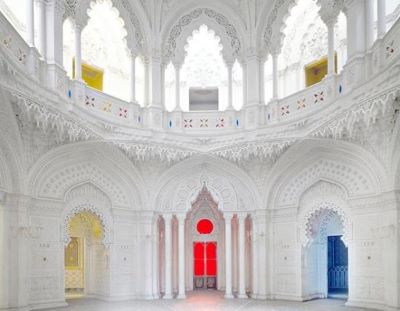 Sammezzano V Sammezzano V by Massimo Listri, white room with detailed stucco decor and yellow red and blue light