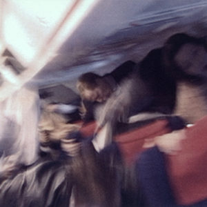 Plain by Alison Jackson, people on a plain falling, blurry image