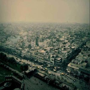 View over Dehli by Andreas H. Bitesnich, the city in green light