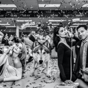 The wolves of wall street color by David Yarrow, party scene in a wallstreet office with a wolf standing on the table looking at the camera
