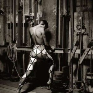 Gabrielle Reece for Vivienne Westwood by Albert Watson, the model in graphic print leggings in the backstage area of a theater