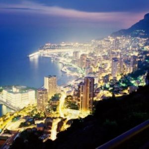 City of gold by David Drebin, Monte Carlo by night with glowing lights and the ocean