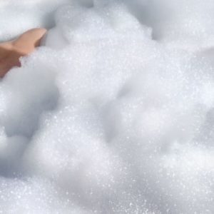 Lips and bubbles by David Drebin, model with red lips in soapy bathtub
