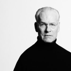 Tim Gunn by Timothy White, black and white portrait of the fashion consultant in a black turtleneck
