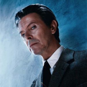 David Bowie, the Look by Markus Klinko, portrait of the singer with blue background
